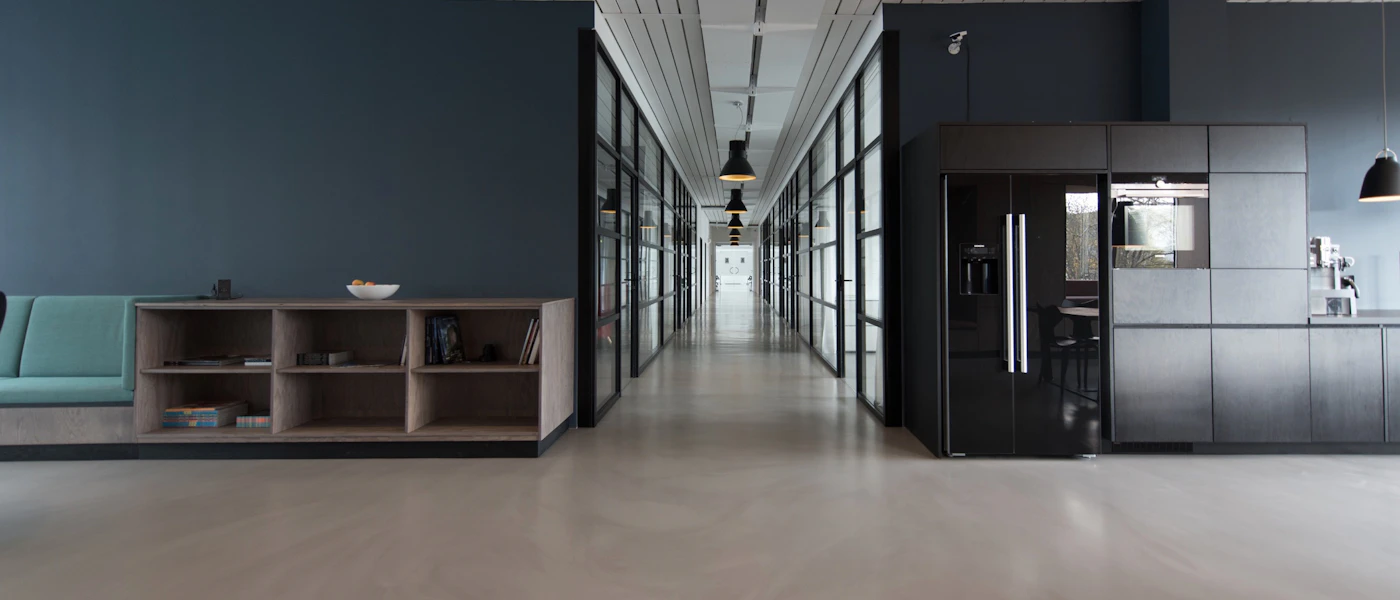 Modern office workspace with security monitoring